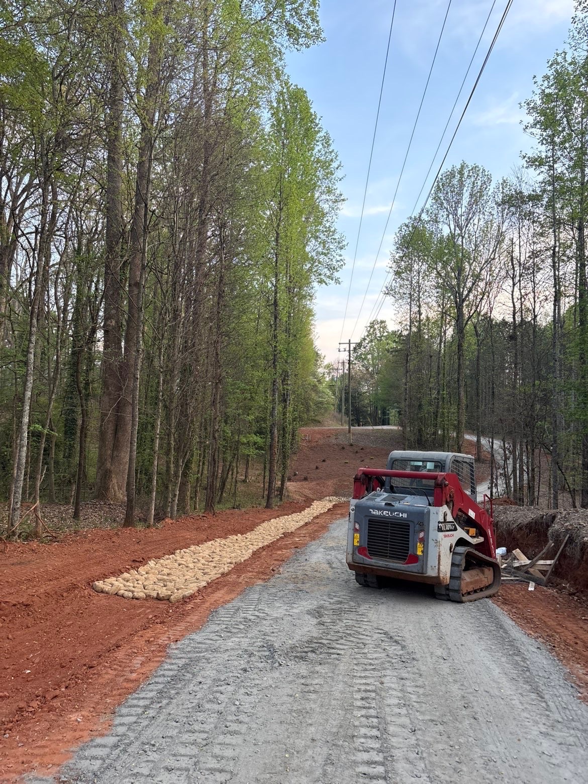 Gravel driveway and grading work crew